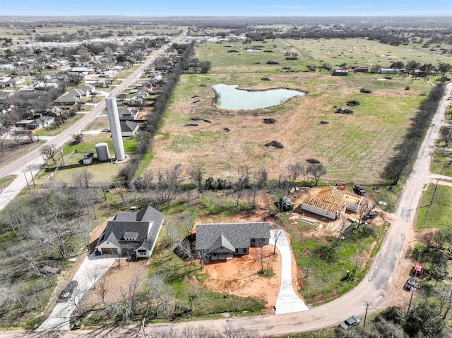 drone / aerial view with a water view and a rural view