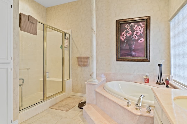 bathroom with tile patterned flooring, a garden tub, a shower stall, and wallpapered walls