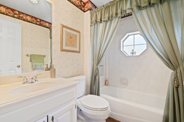 bathroom featuring shower / bathtub combination with curtain, toilet, vanity, and wallpapered walls