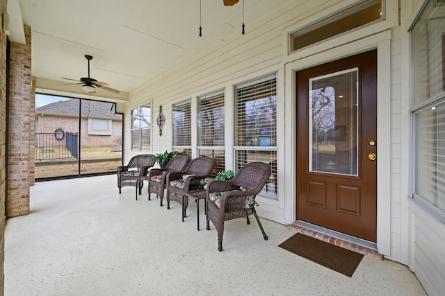 property entrance with a ceiling fan and covered porch