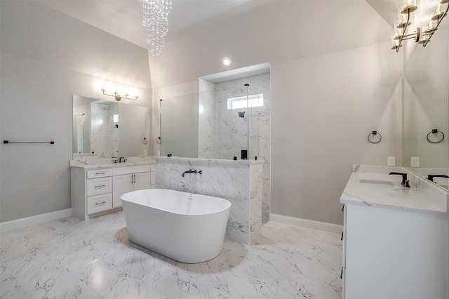 full bath featuring a sink, a marble finish shower, marble finish floor, and a freestanding tub