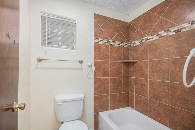 bathroom featuring a textured ceiling and toilet