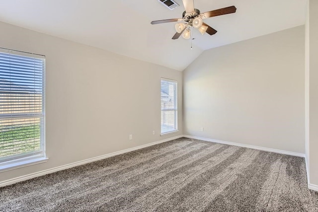 carpeted spare room featuring a ceiling fan, lofted ceiling, visible vents, and baseboards