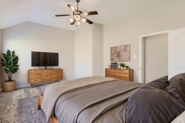 carpeted bedroom featuring vaulted ceiling and ceiling fan