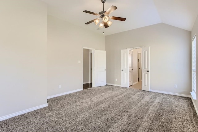 unfurnished bedroom featuring a ceiling fan, lofted ceiling, carpet, and baseboards