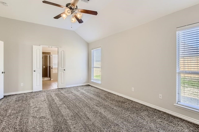 unfurnished bedroom with visible vents, a ceiling fan, baseboards, light colored carpet, and vaulted ceiling