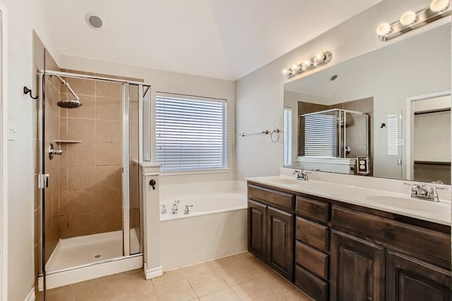 full bath featuring a sink, lofted ceiling, a garden tub, and a shower stall