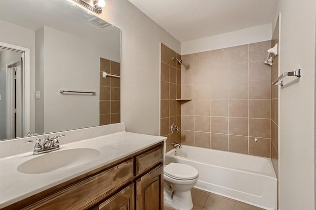 full bath featuring tile patterned flooring, toilet, vanity, and  shower combination