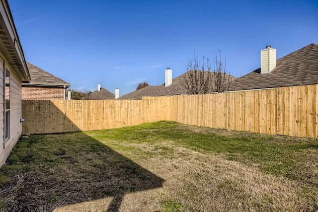 view of yard featuring a fenced backyard