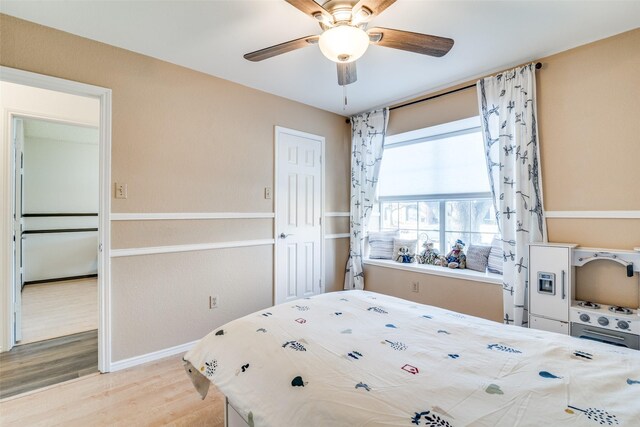 bedroom featuring ceiling fan and wood finished floors