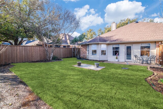 view of yard featuring a patio and a fenced backyard