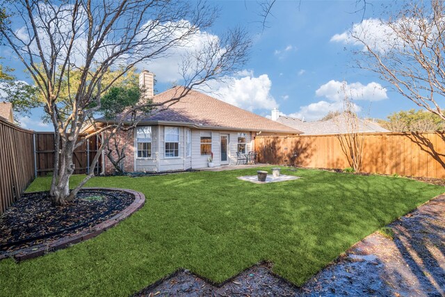 view of yard featuring a fenced backyard and a patio area