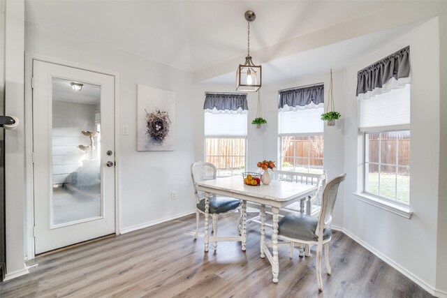 bedroom featuring baseboards, multiple windows, lofted ceiling, and a ceiling fan