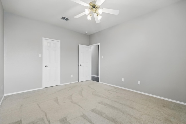 unfurnished bedroom featuring a ceiling fan, carpet flooring, baseboards, and visible vents