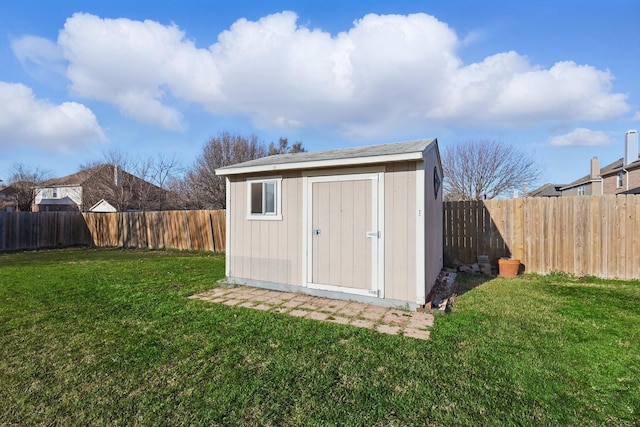 view of shed with a fenced backyard