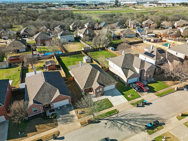 birds eye view of property with a residential view