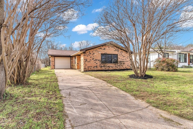 view of front facade with a front yard, an attached garage, brick siding, and driveway