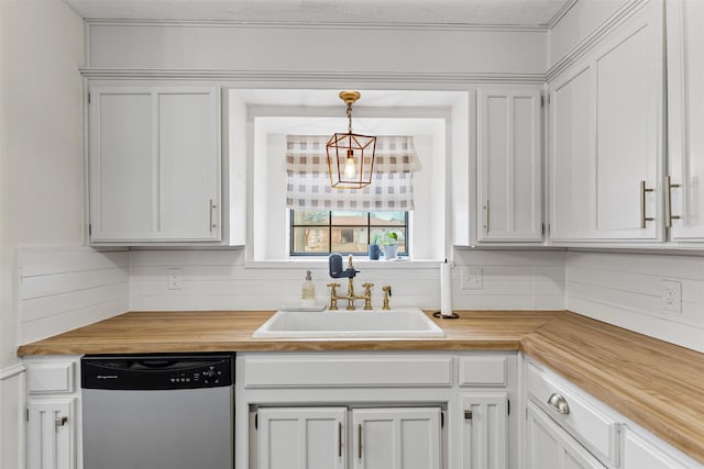 kitchen with a sink, wood counters, backsplash, white cabinets, and dishwasher