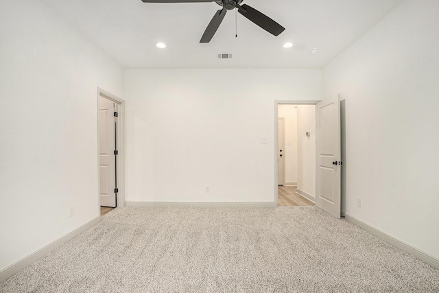 unfurnished room with baseboards, recessed lighting, visible vents, and light carpet