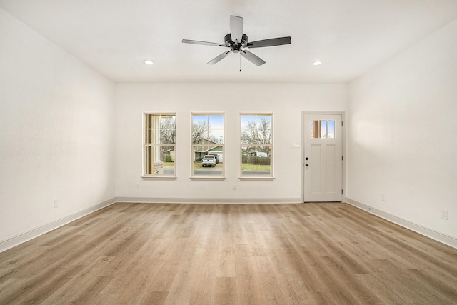 unfurnished living room featuring light wood finished floors, recessed lighting, baseboards, and ceiling fan