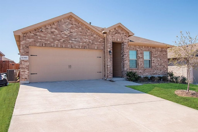 view of front of home with brick siding, central air condition unit, concrete driveway, a front yard, and an attached garage