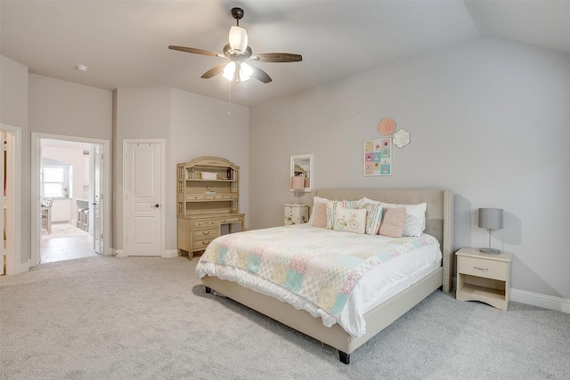 bedroom with carpet flooring, baseboards, ceiling fan, and vaulted ceiling