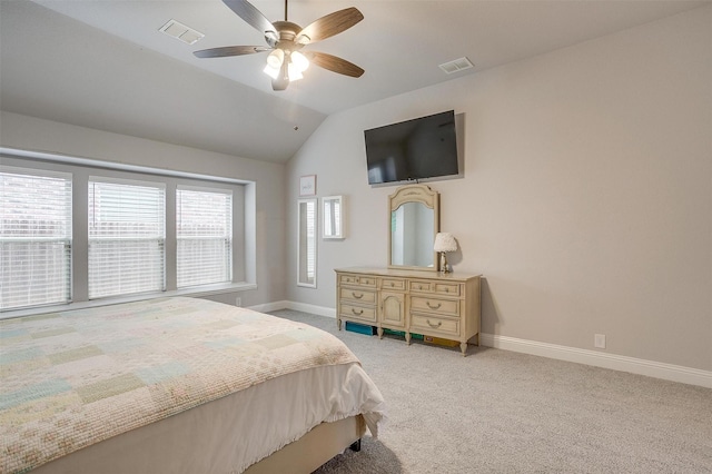 bedroom featuring visible vents, light carpet, lofted ceiling, and baseboards