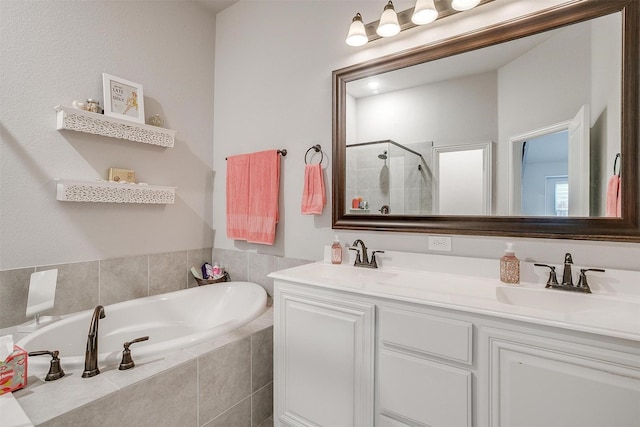 full bathroom with a sink, a stall shower, double vanity, and a bath