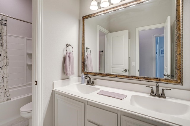 bathroom with double vanity, toilet, shower / bath combo with shower curtain, and a sink