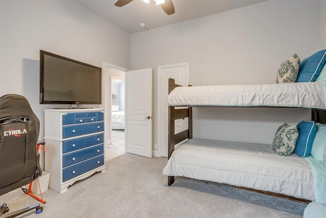 bedroom with light carpet and a ceiling fan