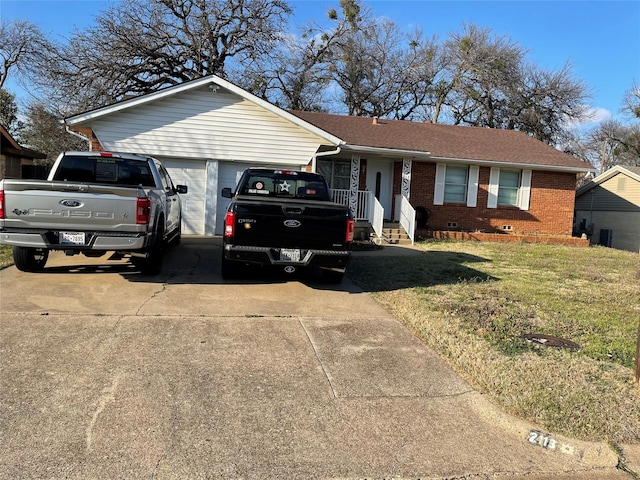 single story home with a garage, a front lawn, concrete driveway, crawl space, and brick siding