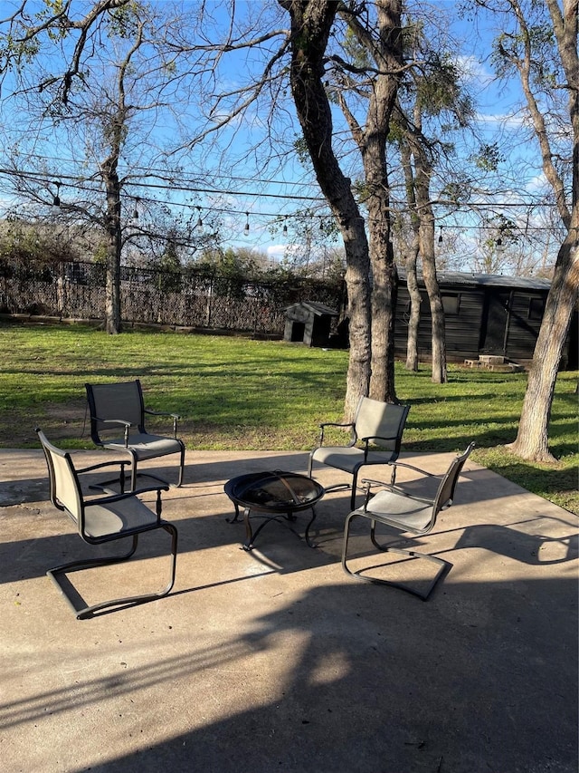 surrounding community with a patio, a lawn, and an outdoor fire pit