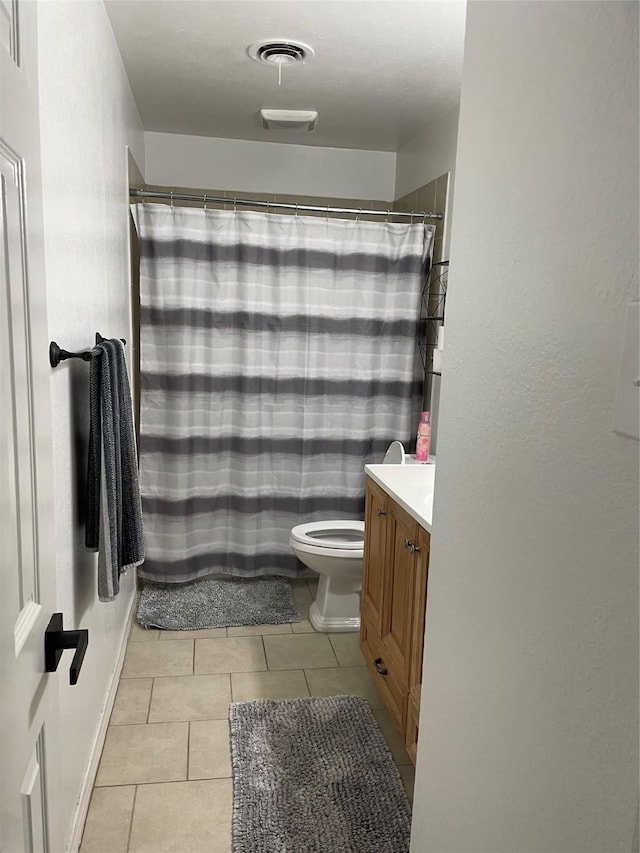 full bathroom with tile patterned floors, visible vents, toilet, curtained shower, and vanity