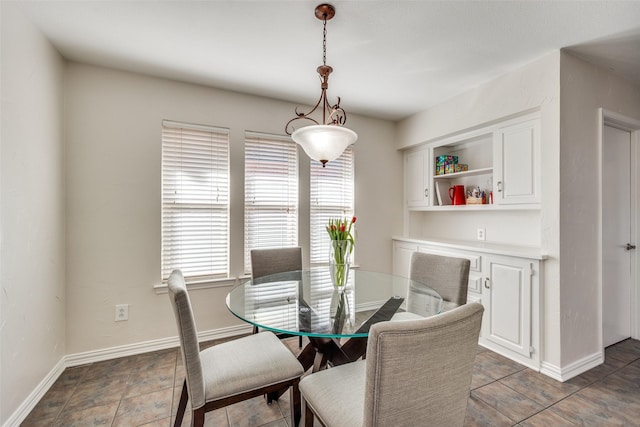 dining room featuring baseboards