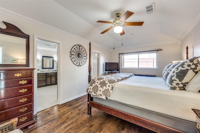 bedroom featuring visible vents, baseboards, dark wood finished floors, lofted ceiling, and ornamental molding