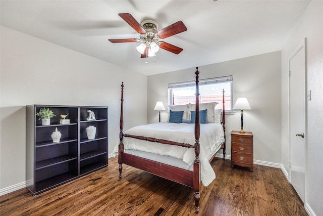 bedroom with a ceiling fan, baseboards, and wood finished floors