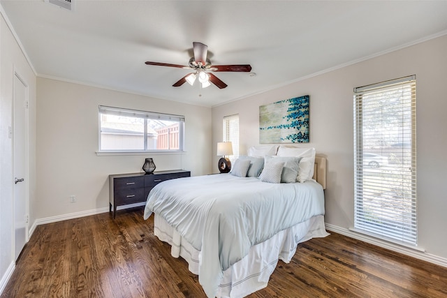 bedroom featuring ornamental molding, a ceiling fan, baseboards, and dark wood-style flooring