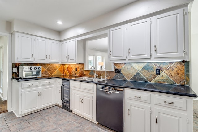 kitchen featuring beverage cooler, a sink, black dishwasher, white cabinetry, and dark countertops