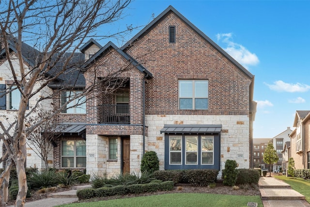 view of front facade with stone siding and brick siding