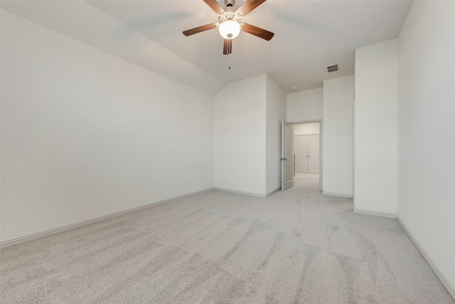 empty room with visible vents, light carpet, baseboards, and a ceiling fan