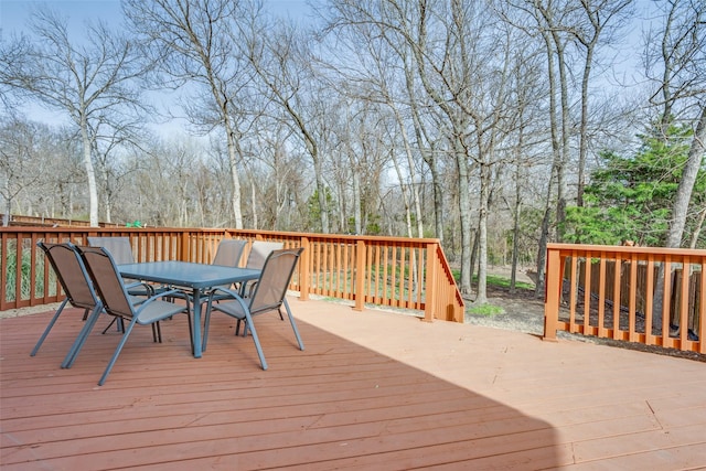 wooden terrace featuring outdoor dining area