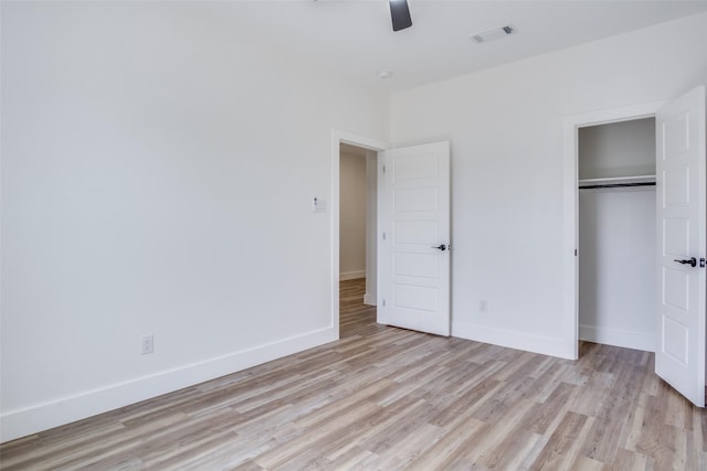 unfurnished bedroom featuring visible vents, baseboards, and light wood finished floors