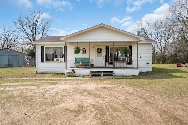 bungalow featuring a porch and a front yard