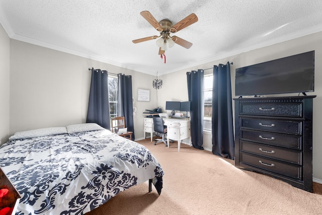 bedroom featuring baseboards, carpet floors, ceiling fan, ornamental molding, and a textured ceiling