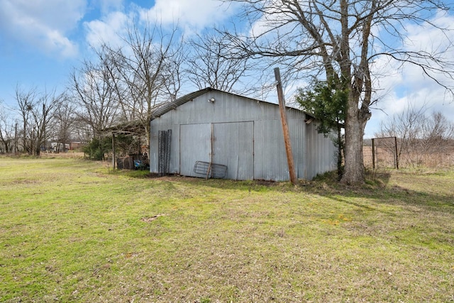 view of pole building with a lawn