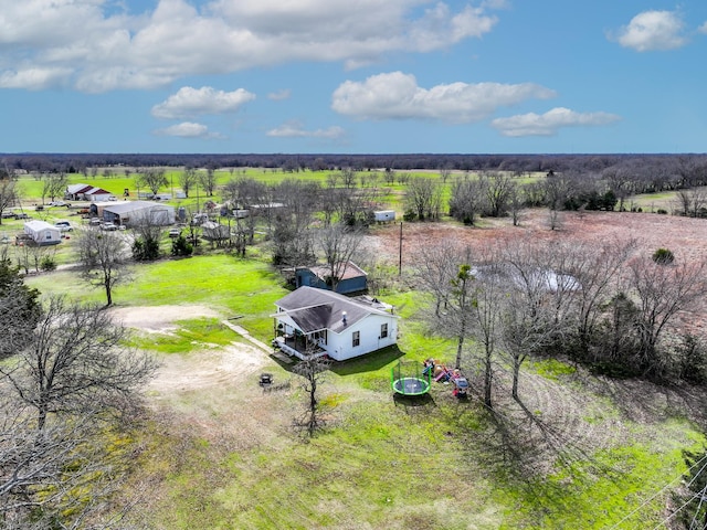 birds eye view of property with a rural view