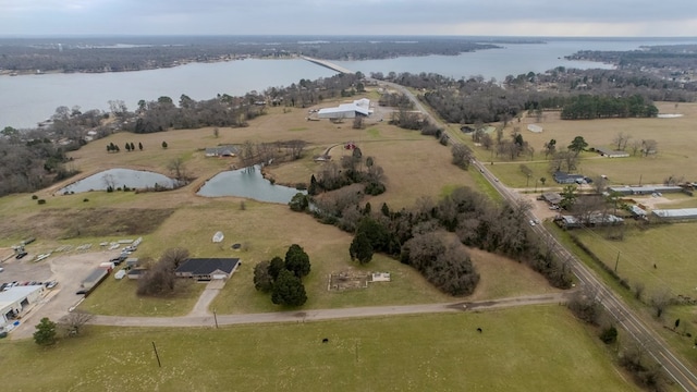 drone / aerial view featuring a water view and a rural view