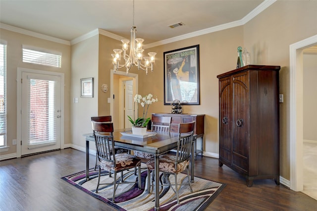 dining area featuring dark wood finished floors, baseboards, visible vents, and ornamental molding