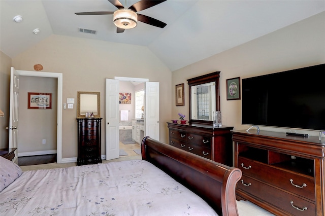 bedroom featuring visible vents, ceiling fan, ensuite bathroom, and lofted ceiling