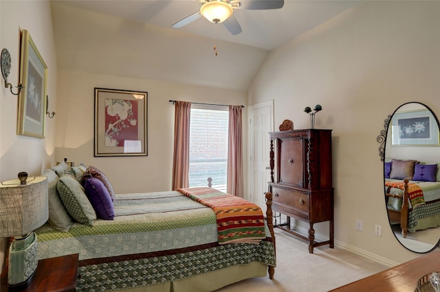 bedroom with baseboards, lofted ceiling, light carpet, and a ceiling fan